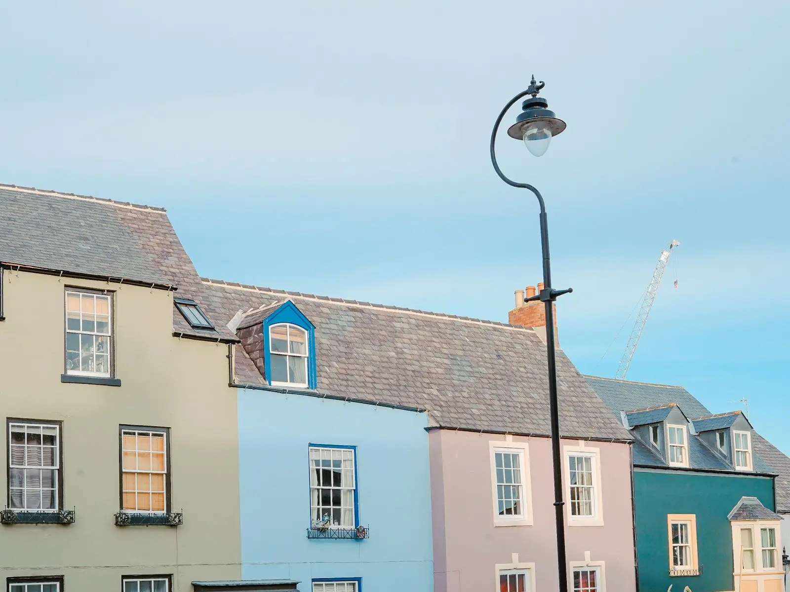 Painted terraced houses running down to the quay